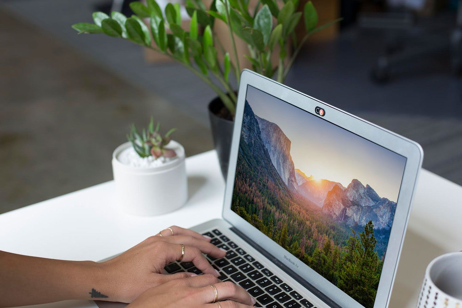 Photo showing the DuckDuckGo webcam cover on a laptop